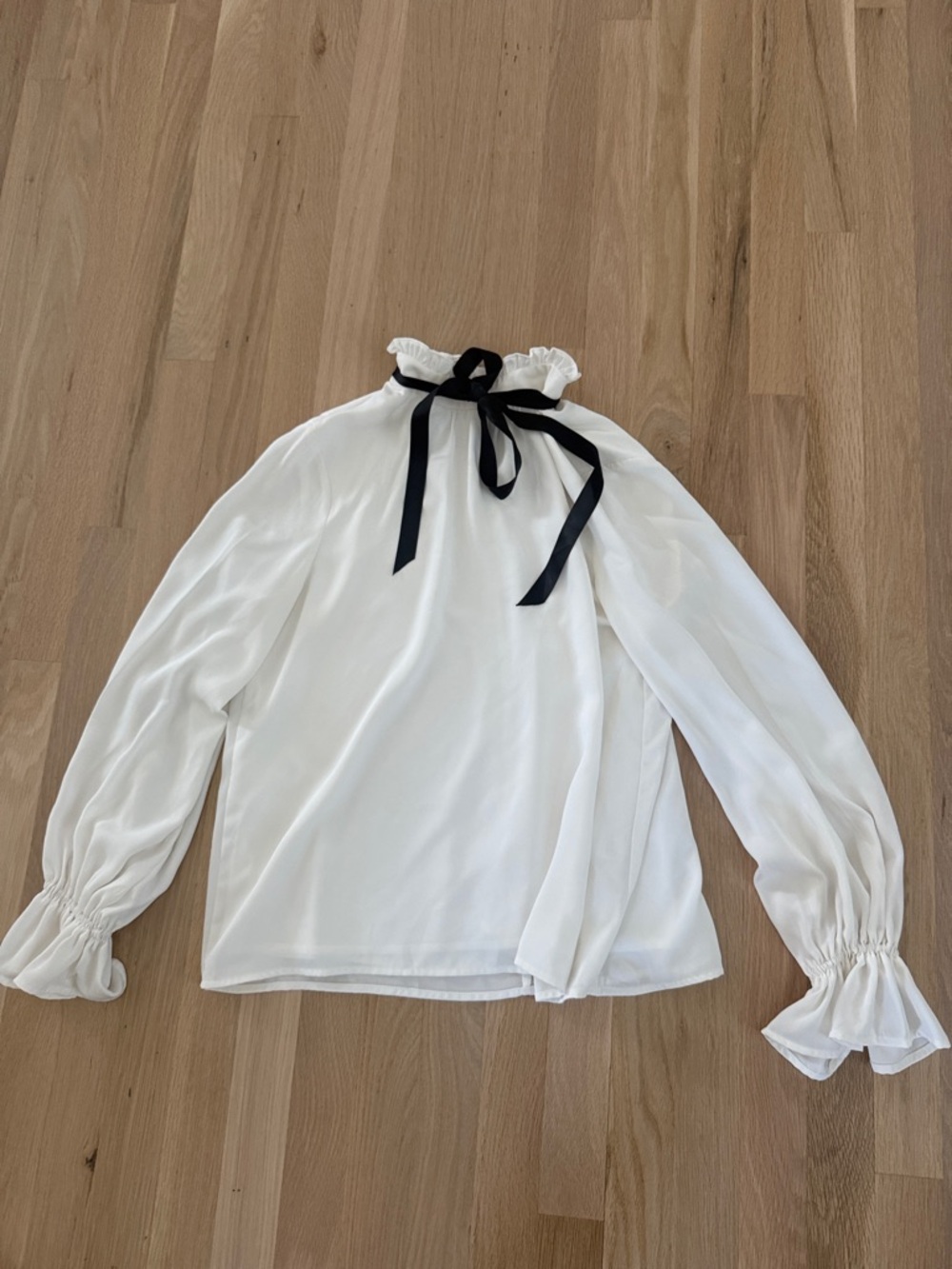 Vici White Ruffle-Neck Blouse with Black Ribbon Tie